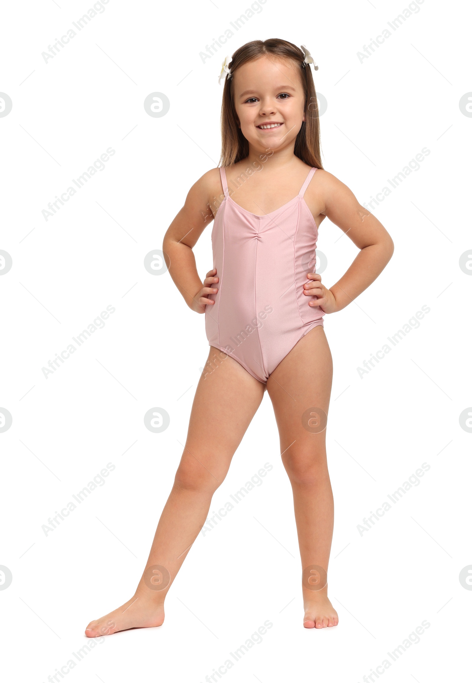 Photo of Cute little girl in swimsuit on white background