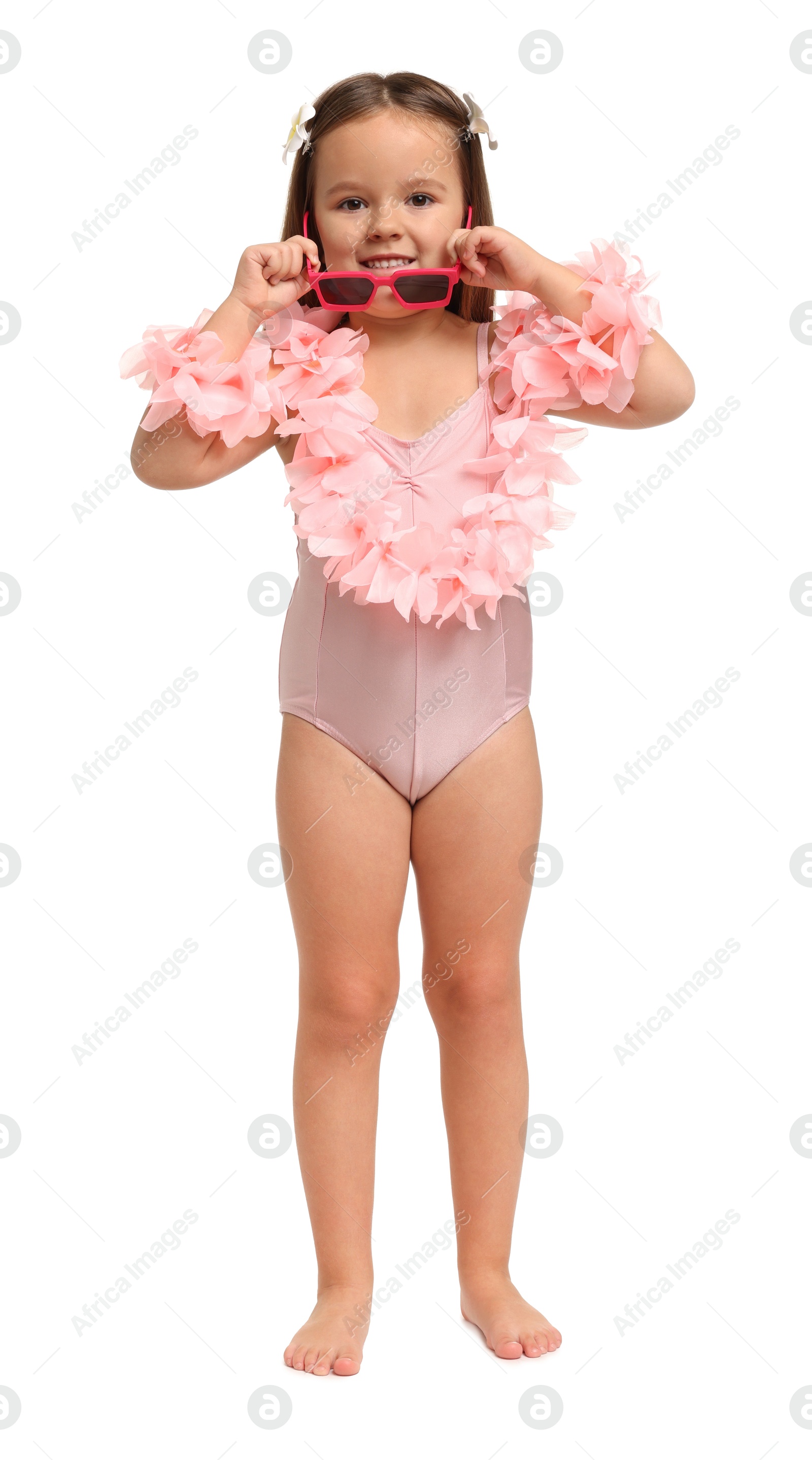 Photo of Cute little girl in swimsuit on white background