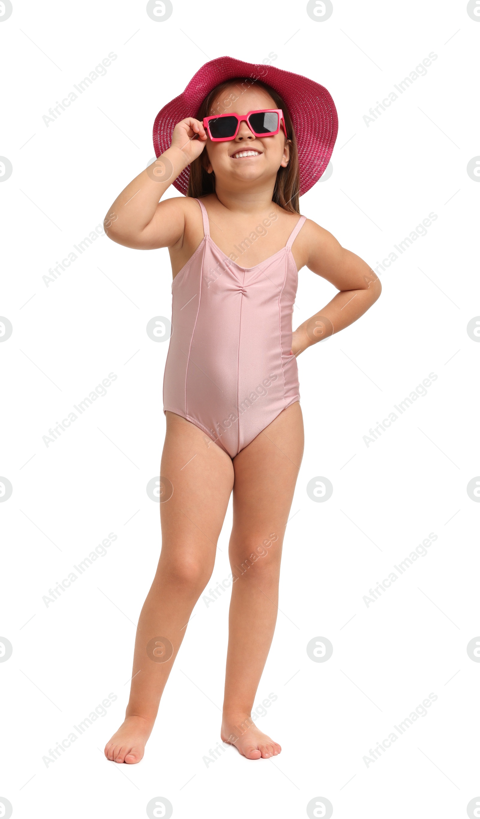 Photo of Cute little girl in swimsuit with hat on white background