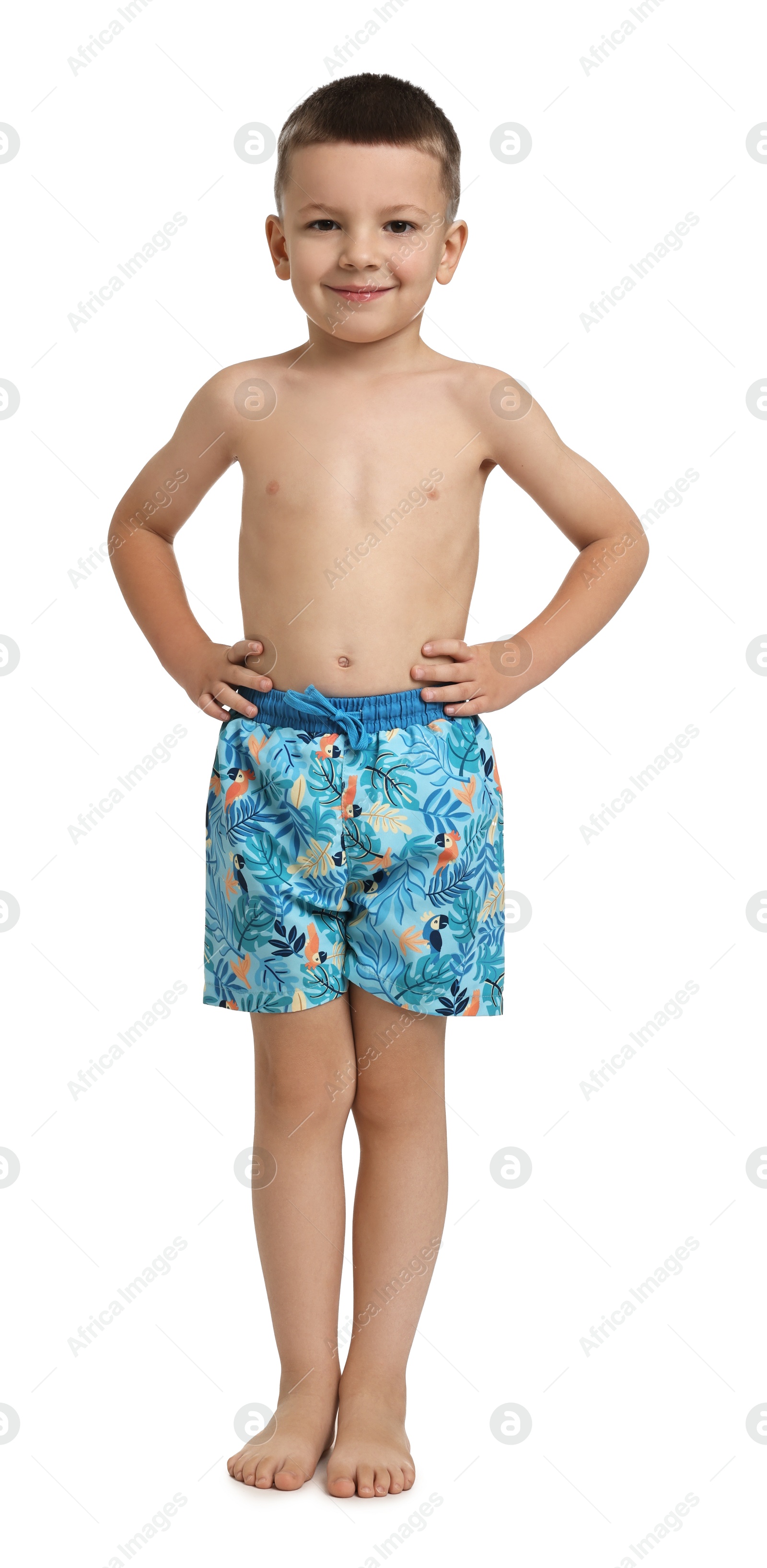 Photo of Cute little boy in beachwear on white background