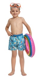 Photo of Cute little boy in beachwear with inflatable ring on white background