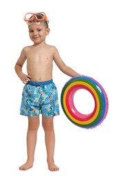 Photo of Cute little boy in beachwear with inflatable ring on white background