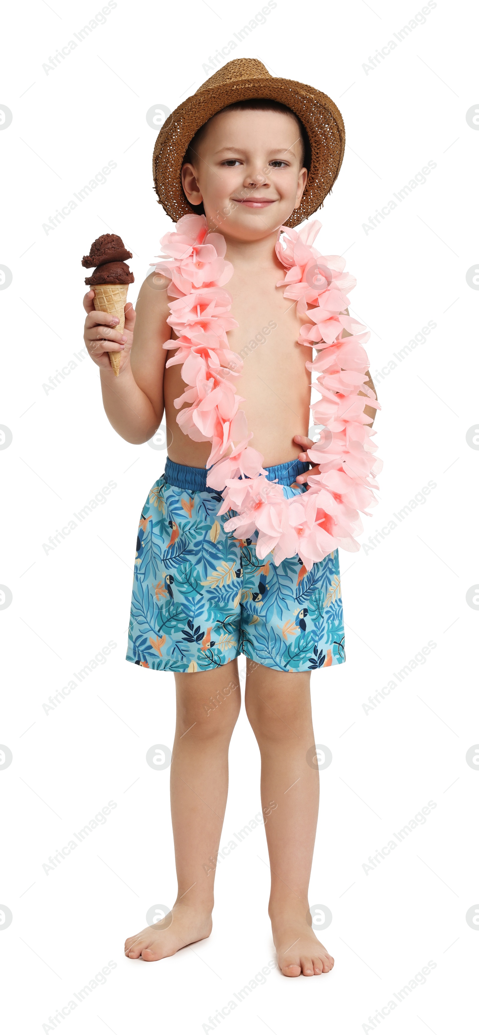 Photo of Cute little boy in beachwear with ice cream on white background