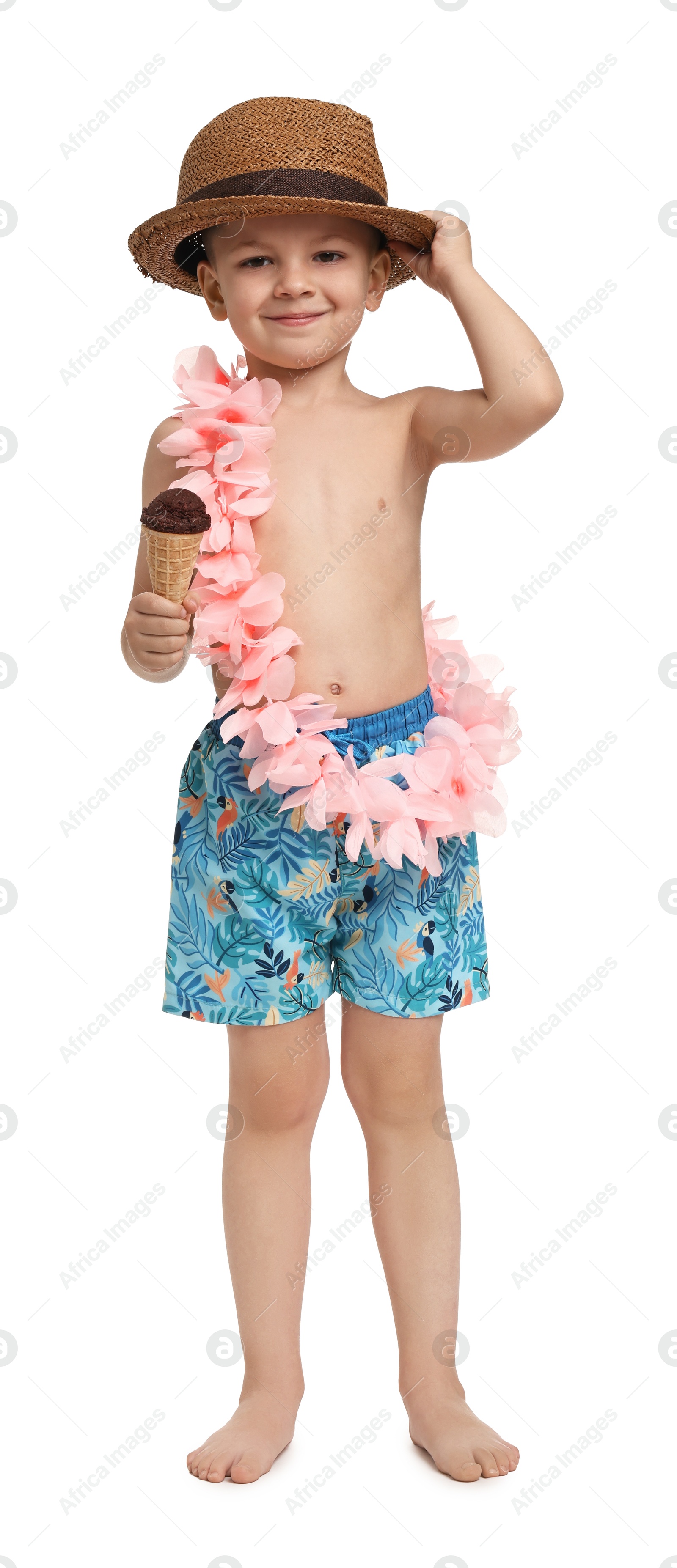 Photo of Cute little boy in beachwear with ice cream on white background