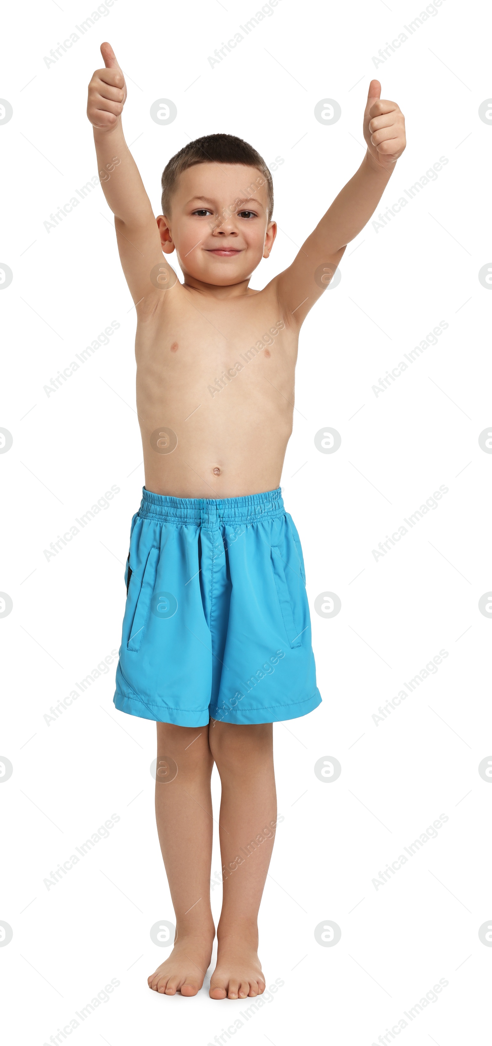 Photo of Cute little boy in beachwear showing thumbs up on white background