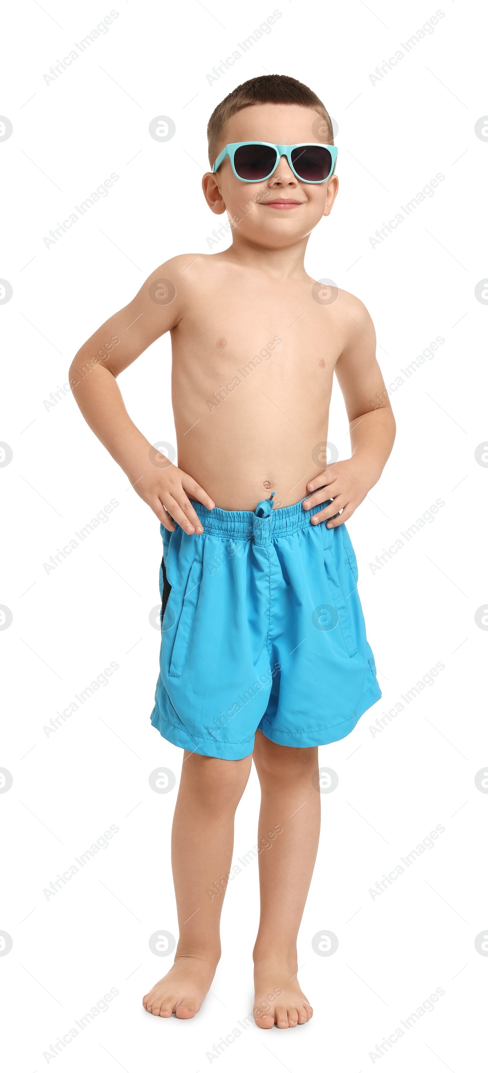 Photo of Cute little boy in beachwear on white background