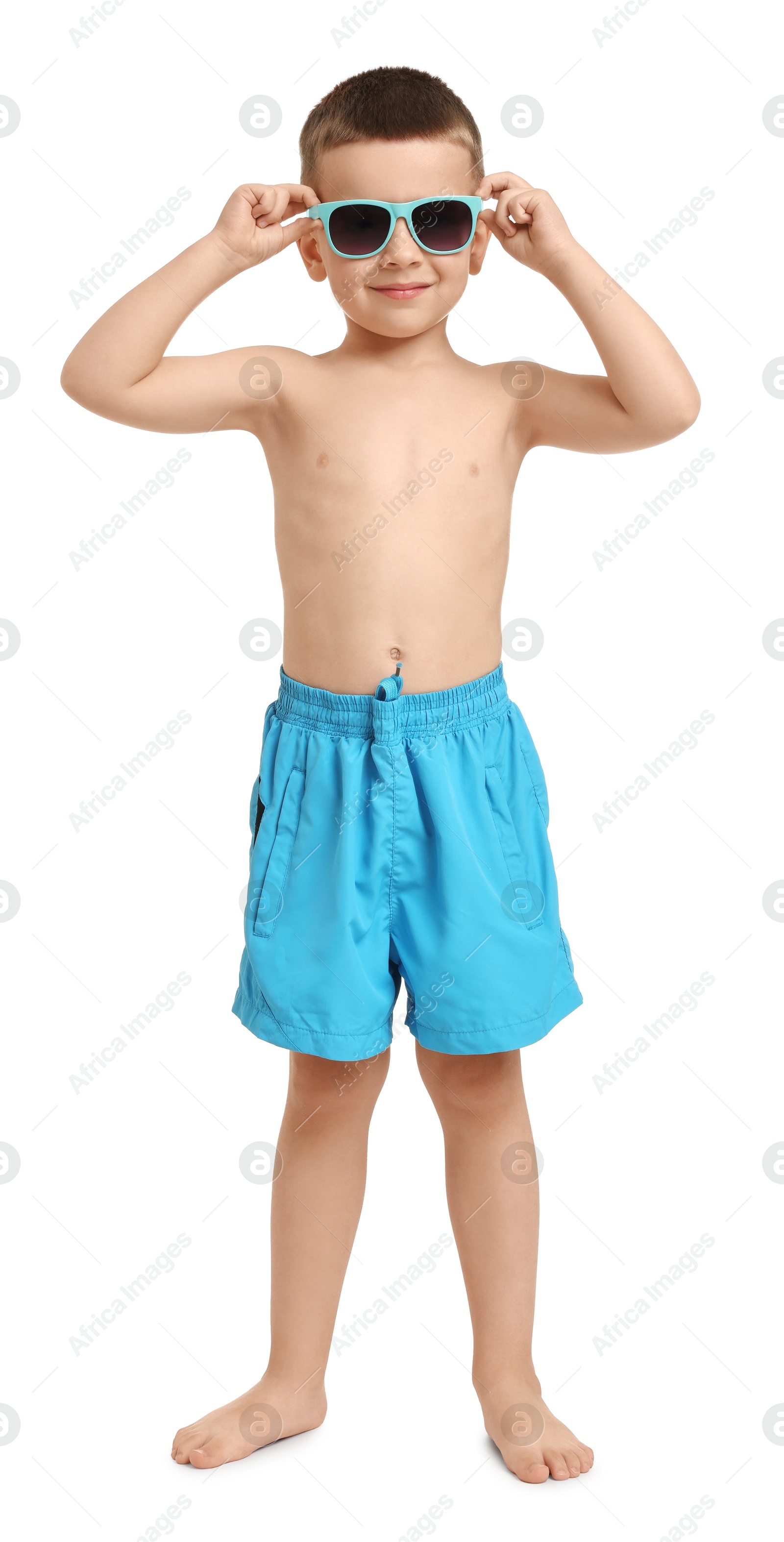 Photo of Cute little boy in beachwear on white background