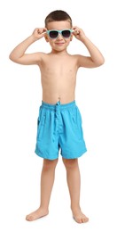 Photo of Cute little boy in beachwear on white background