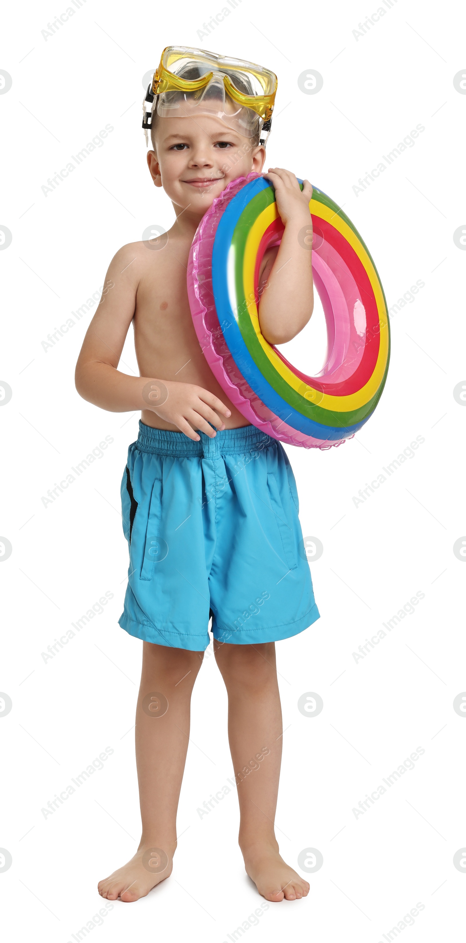 Photo of Cute little boy in beachwear with inflatable ring and diving mask on white background