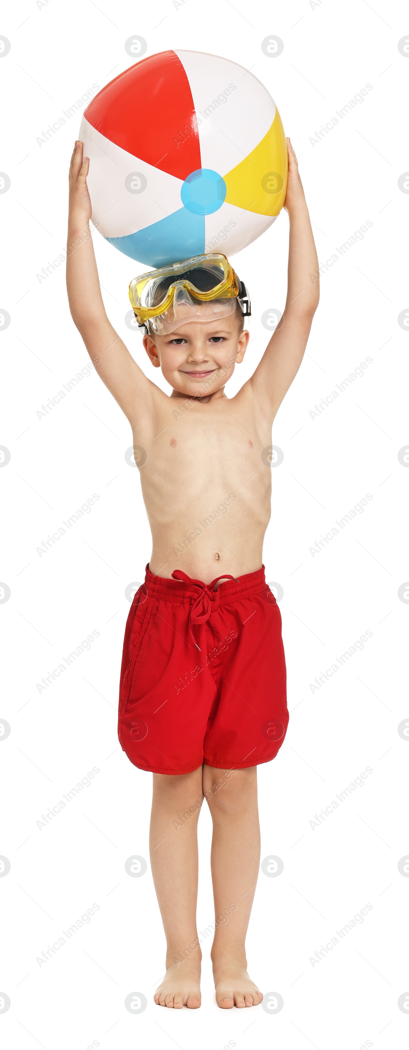 Photo of Cute little boy in beachwear with inflatable ball and mask on white background