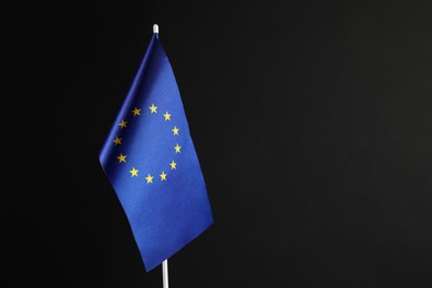 Photo of One flag of European Union on black background. Space for text