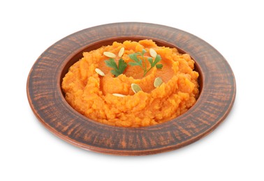 Photo of Tasty mashed sweet potato with pumpkin seeds and parsley in bowl isolated on white