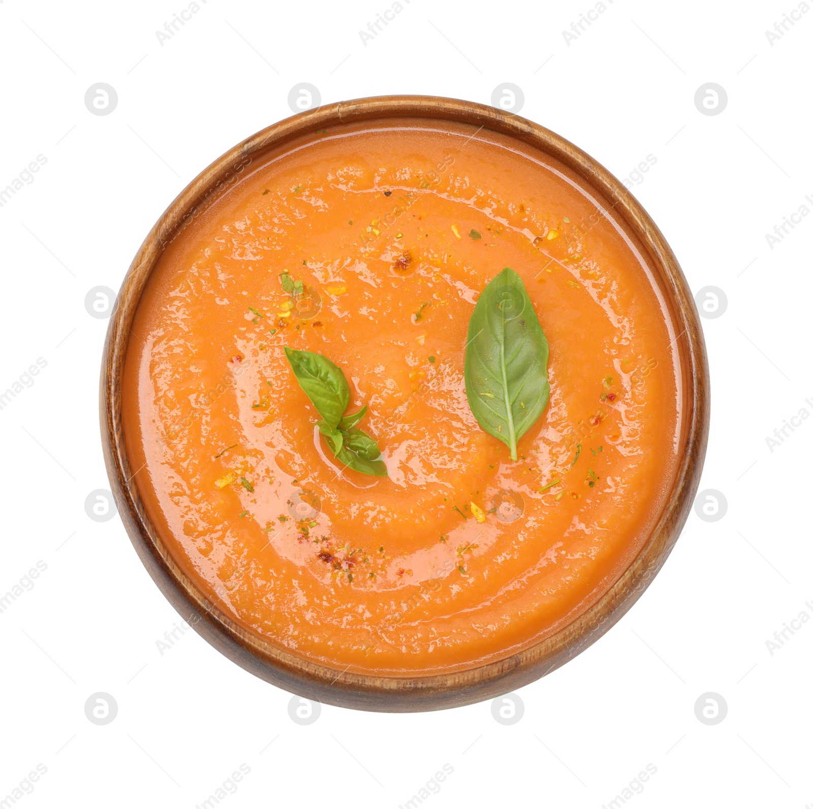 Delicious sweet potato soup with spices and basil in bowl isolated on white, top view Photo of Delicious sweet potato soup with spices and basil in bowl isolated on white, top view