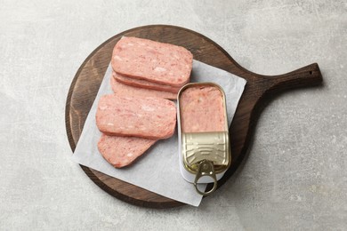 Photo of Tasty canned meat on grey table, top view