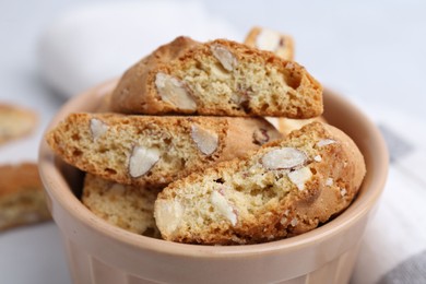 Photo of Tasty almond biscuits (Cantuccini) in bowl, closeup