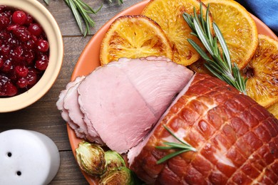 Christmas food. Tasty baked ham served on wooden table, flat lay