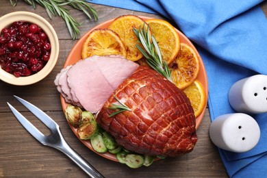 Christmas food. Tasty baked ham served on wooden table, flat lay