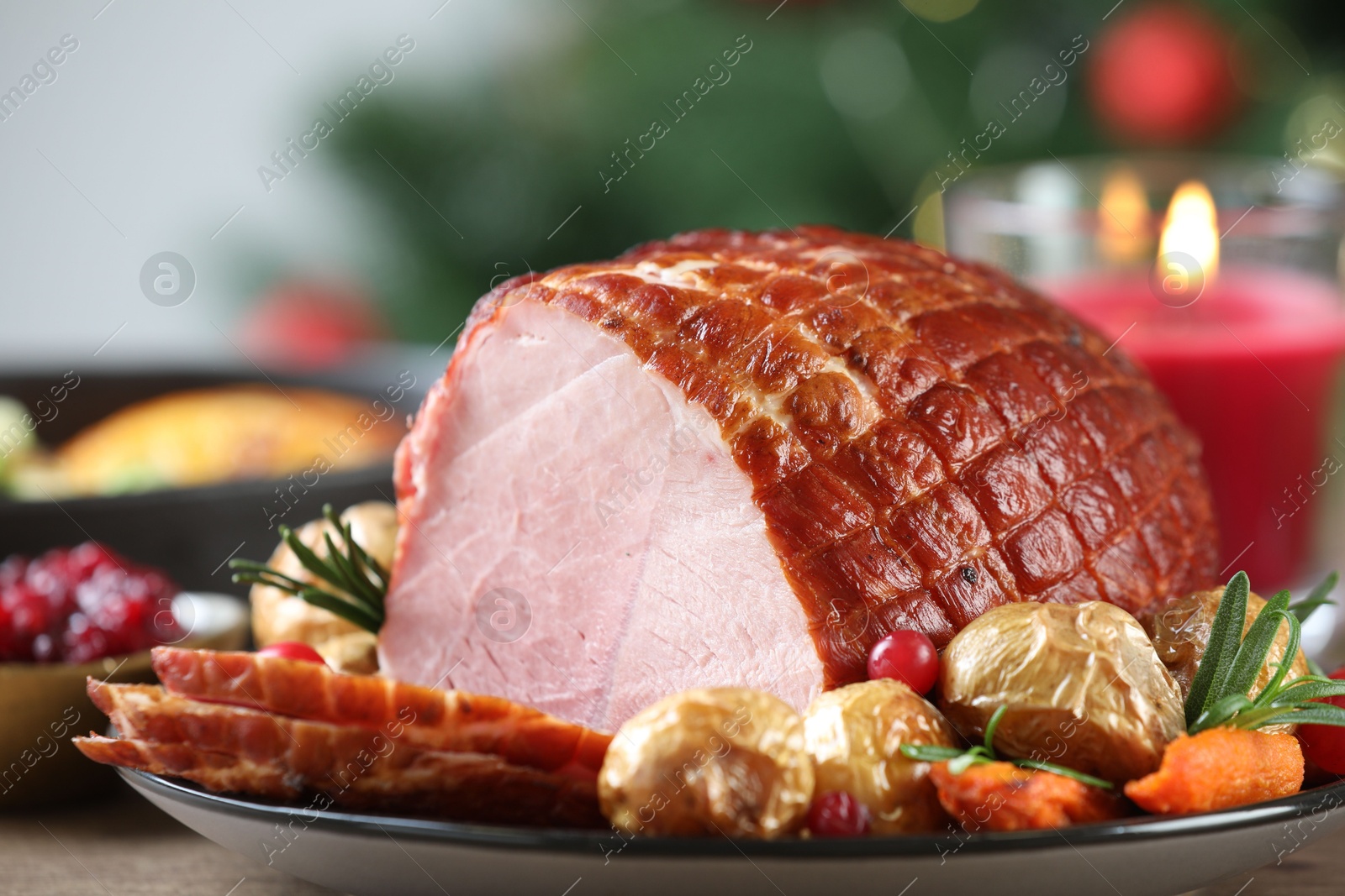 Photo of Christmas food. Tasty baked ham served on table, closeup