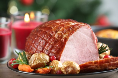 Photo of Christmas food. Tasty baked ham served on table, closeup