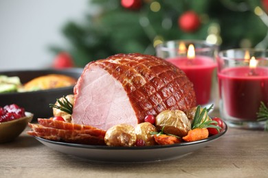 Christmas food. Tasty baked ham served on wooden table, closeup