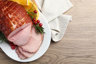 Christmas food. Tasty baked ham served on wooden table, top view and space for text