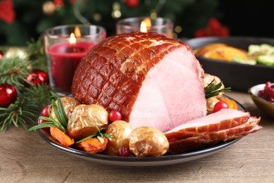 Photo of Christmas food. Tasty baked ham served on wooden table, closeup