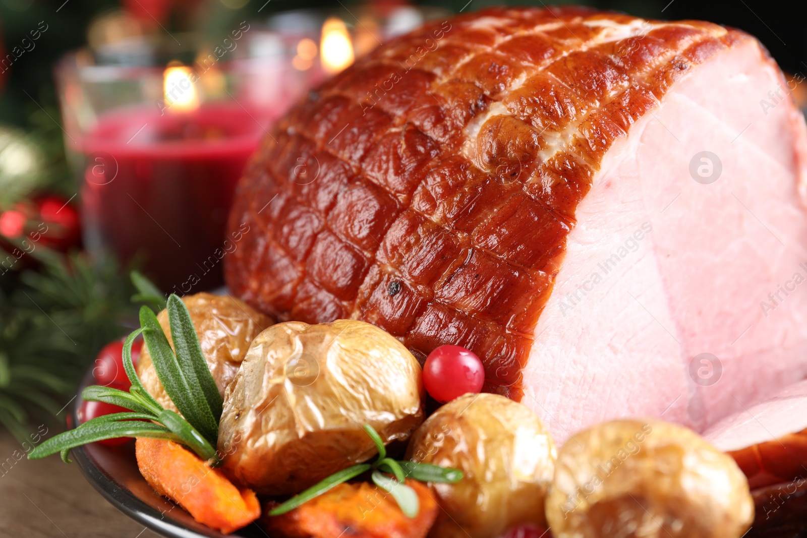 Photo of Christmas food. Tasty baked ham served on table, closeup