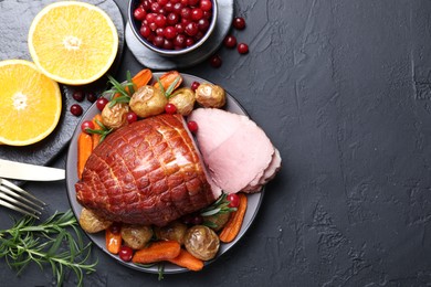 Photo of Christmas food. Tasty baked ham served on black table, flat lay and space for text