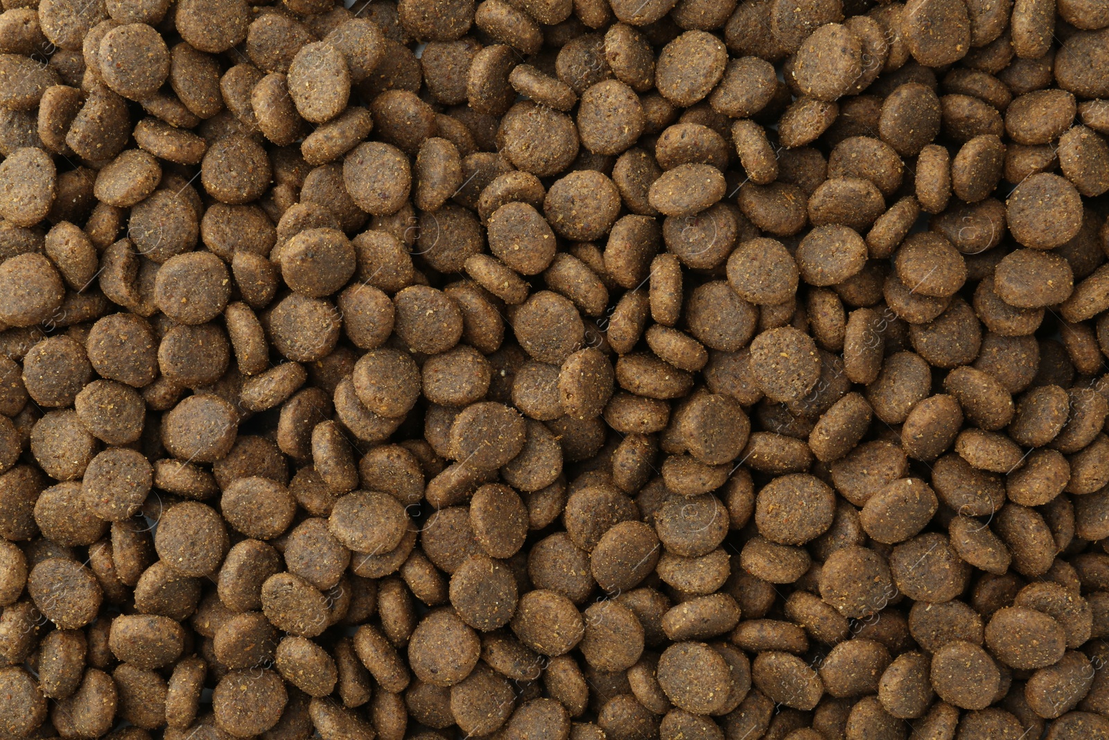 Photo of Pet food granules as background, top view