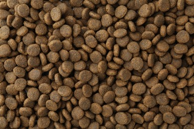 Photo of Pet food granules as background, top view