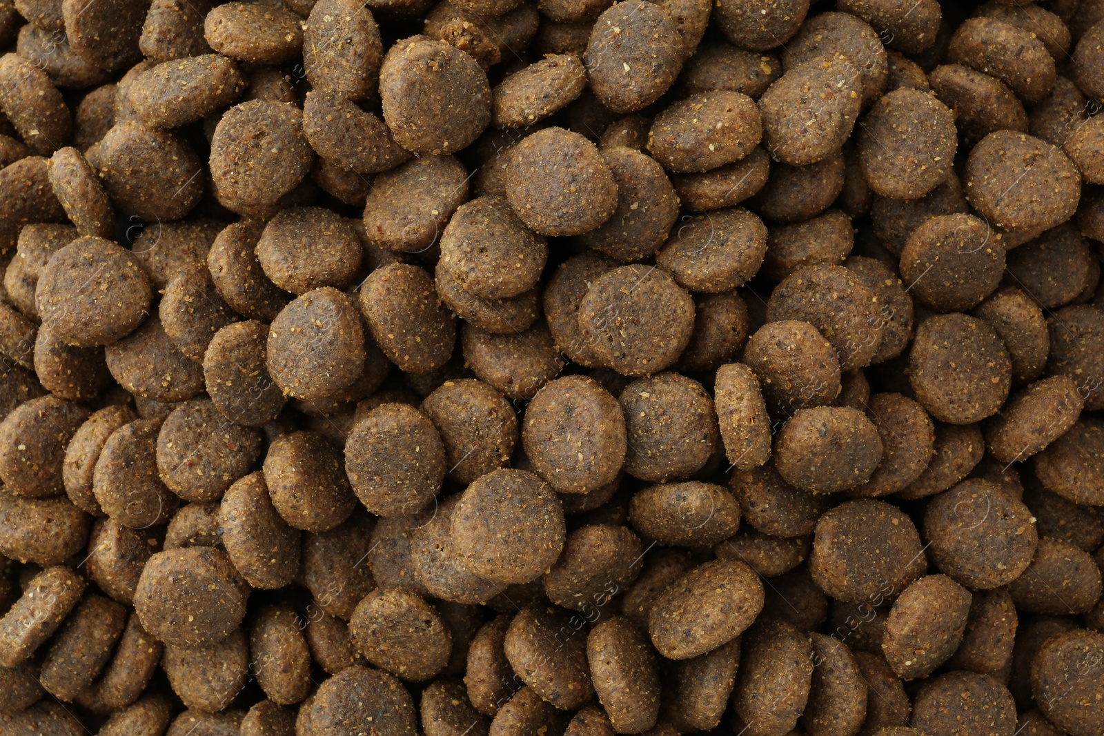 Photo of Pet food granules as background, top view