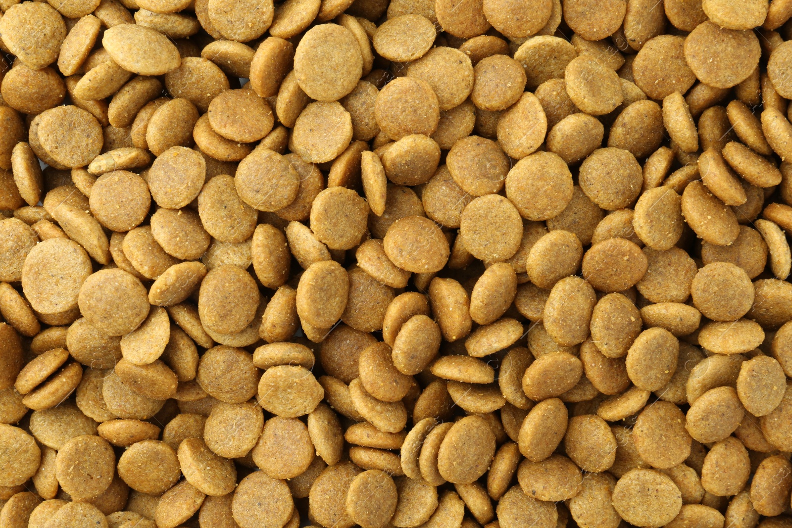 Photo of Pet food granules as background, top view