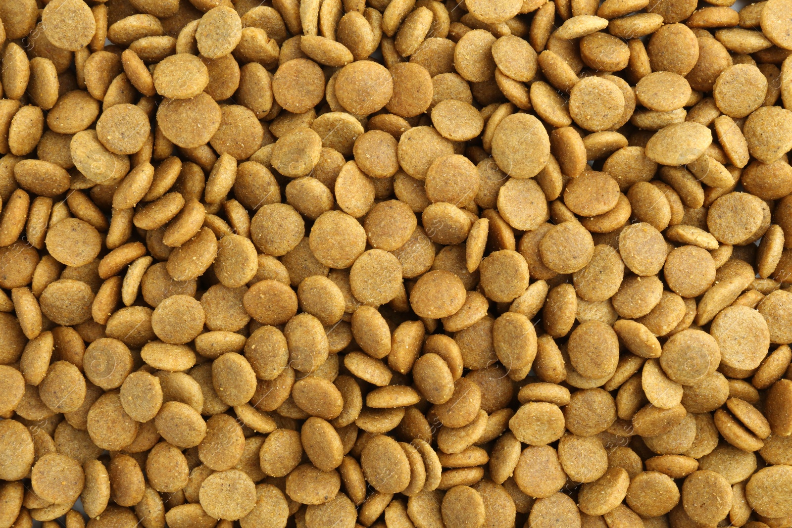 Photo of Pet food granules as background, top view