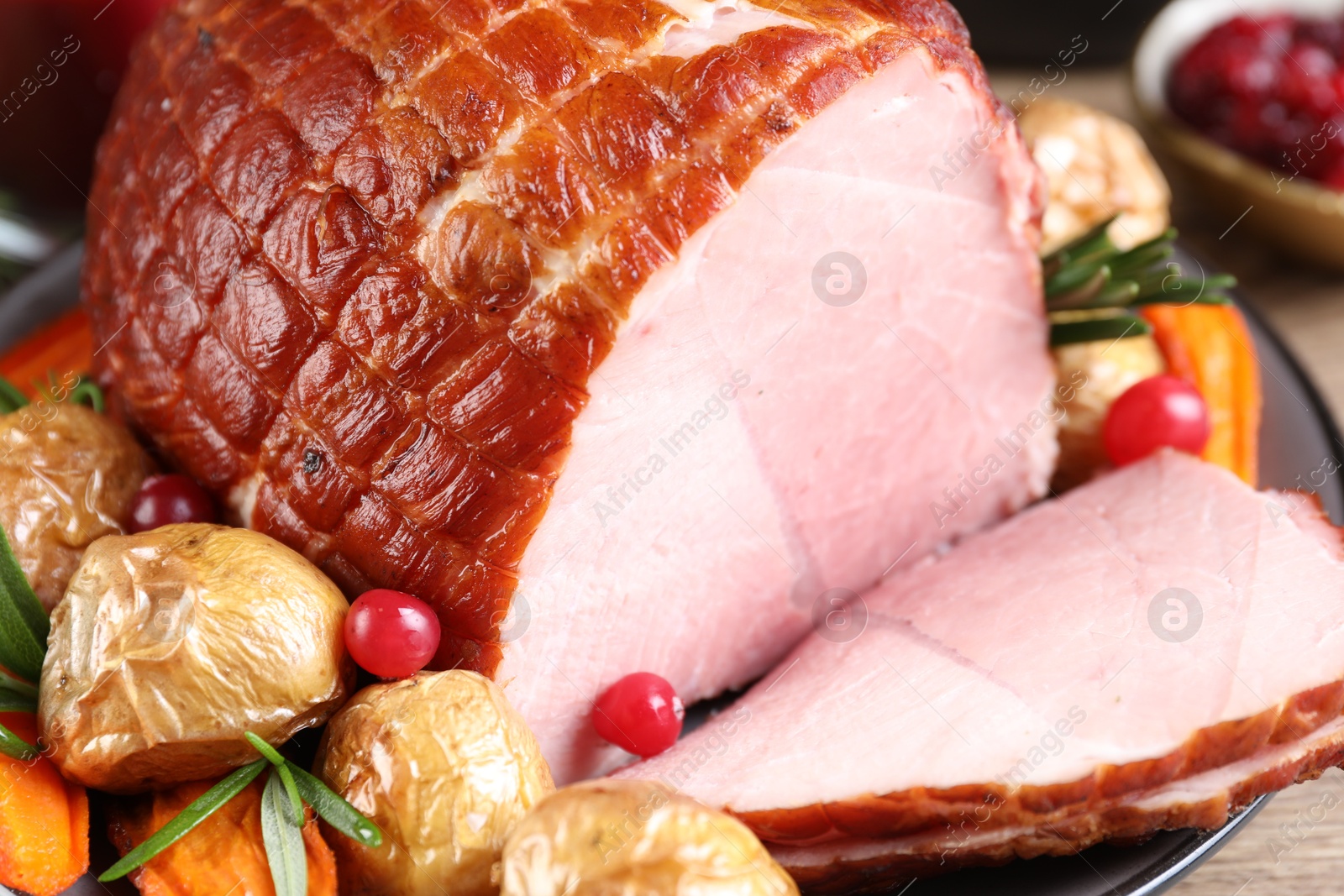 Photo of Christmas food. Tasty baked ham served on table, closeup