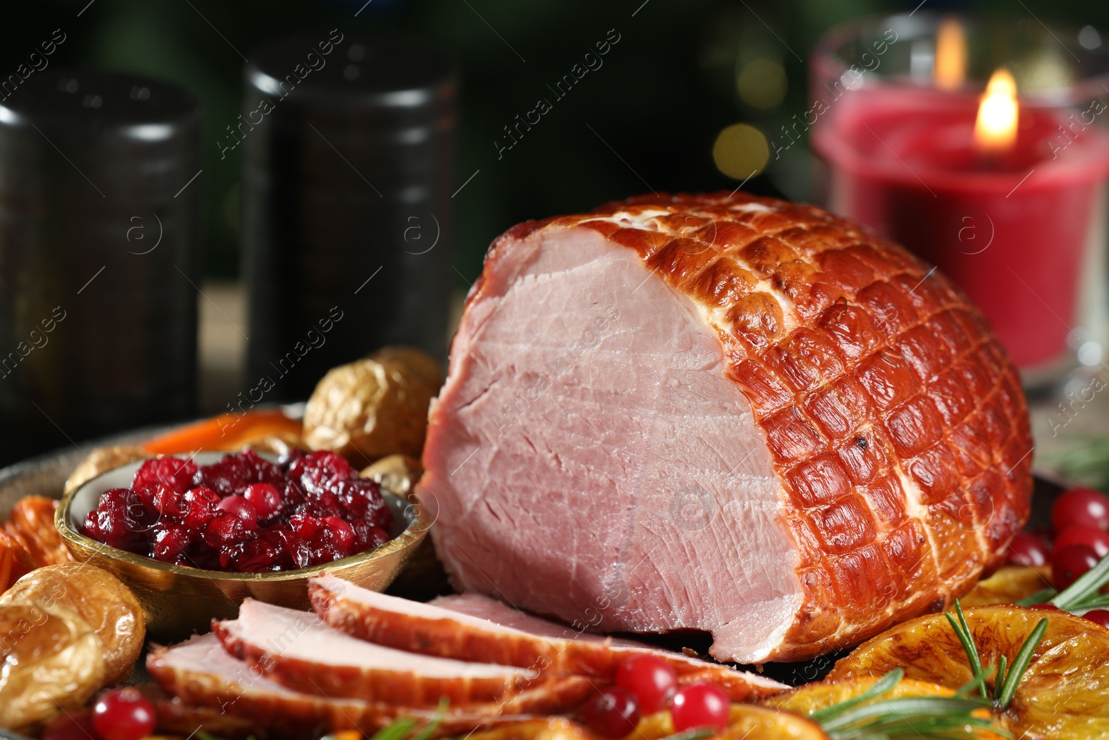 Photo of Christmas food. Tasty baked ham served on table, closeup