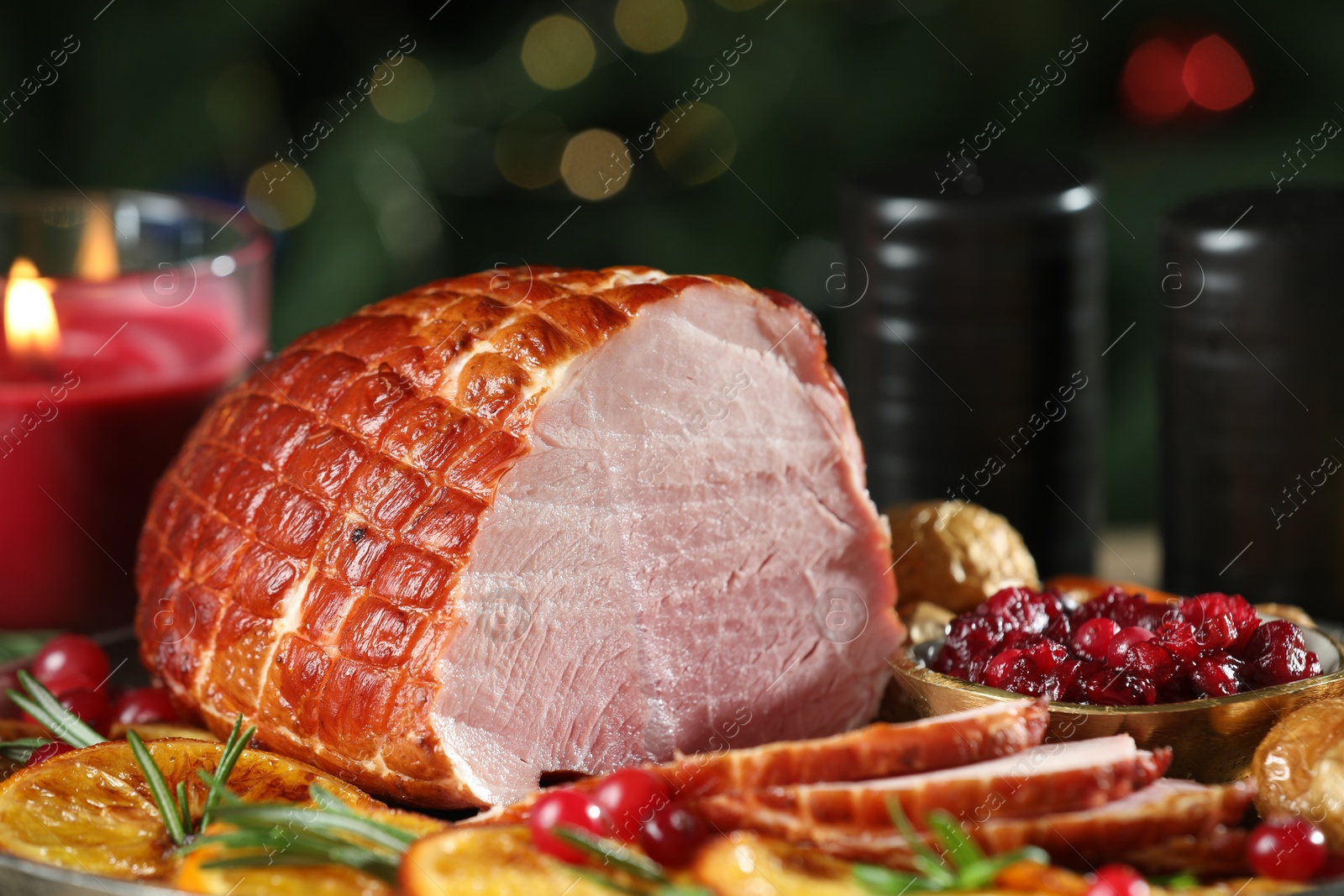 Photo of Christmas food. Tasty baked ham served on table, closeup