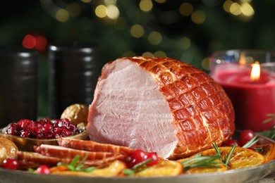 Photo of Christmas food. Tasty baked ham served on table, closeup