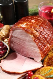 Photo of Christmas food. Tasty baked ham served on table, closeup