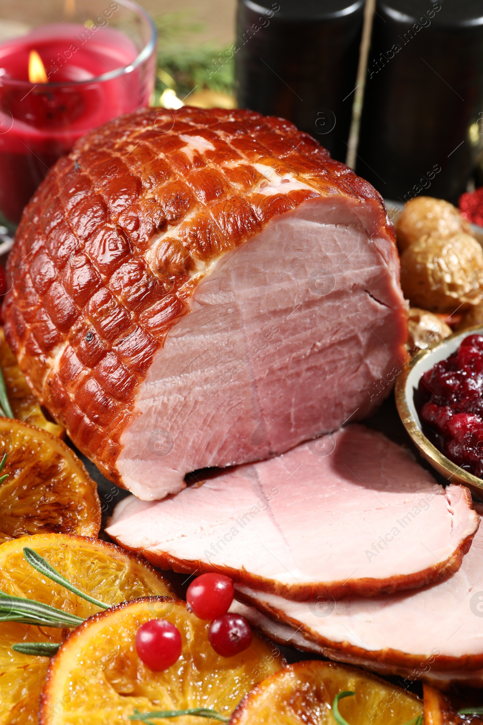 Photo of Christmas food. Tasty baked ham served on table, closeup