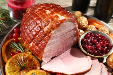 Photo of Christmas food. Tasty baked ham served on table, closeup