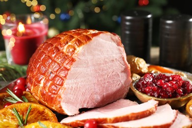 Photo of Christmas food. Tasty baked ham served on table, closeup