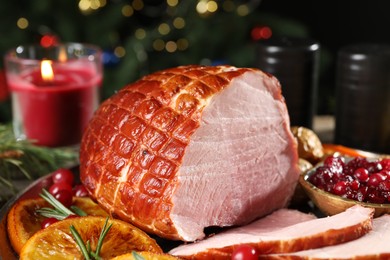 Photo of Christmas food. Tasty baked ham served on table, closeup