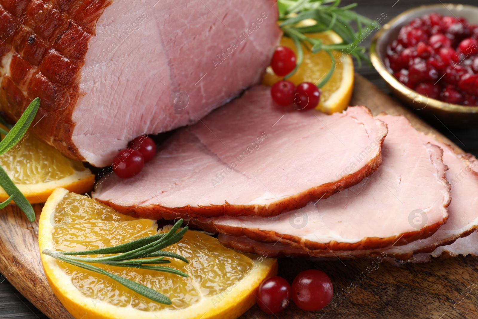 Photo of Christmas food. Tasty baked ham served on table, closeup