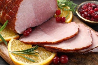 Photo of Christmas food. Tasty baked ham served on table, closeup