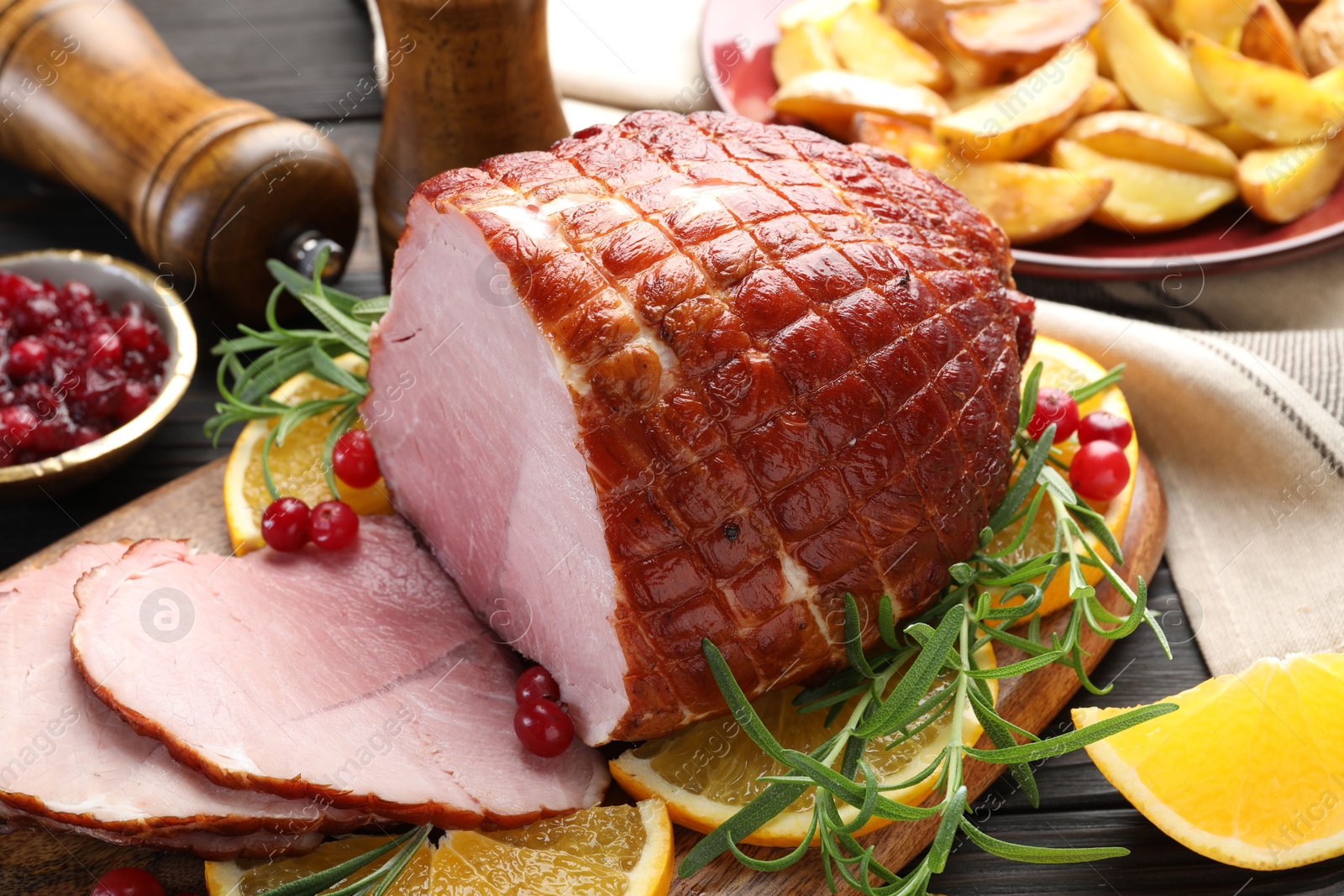 Photo of Christmas food. Tasty baked ham served on table, closeup