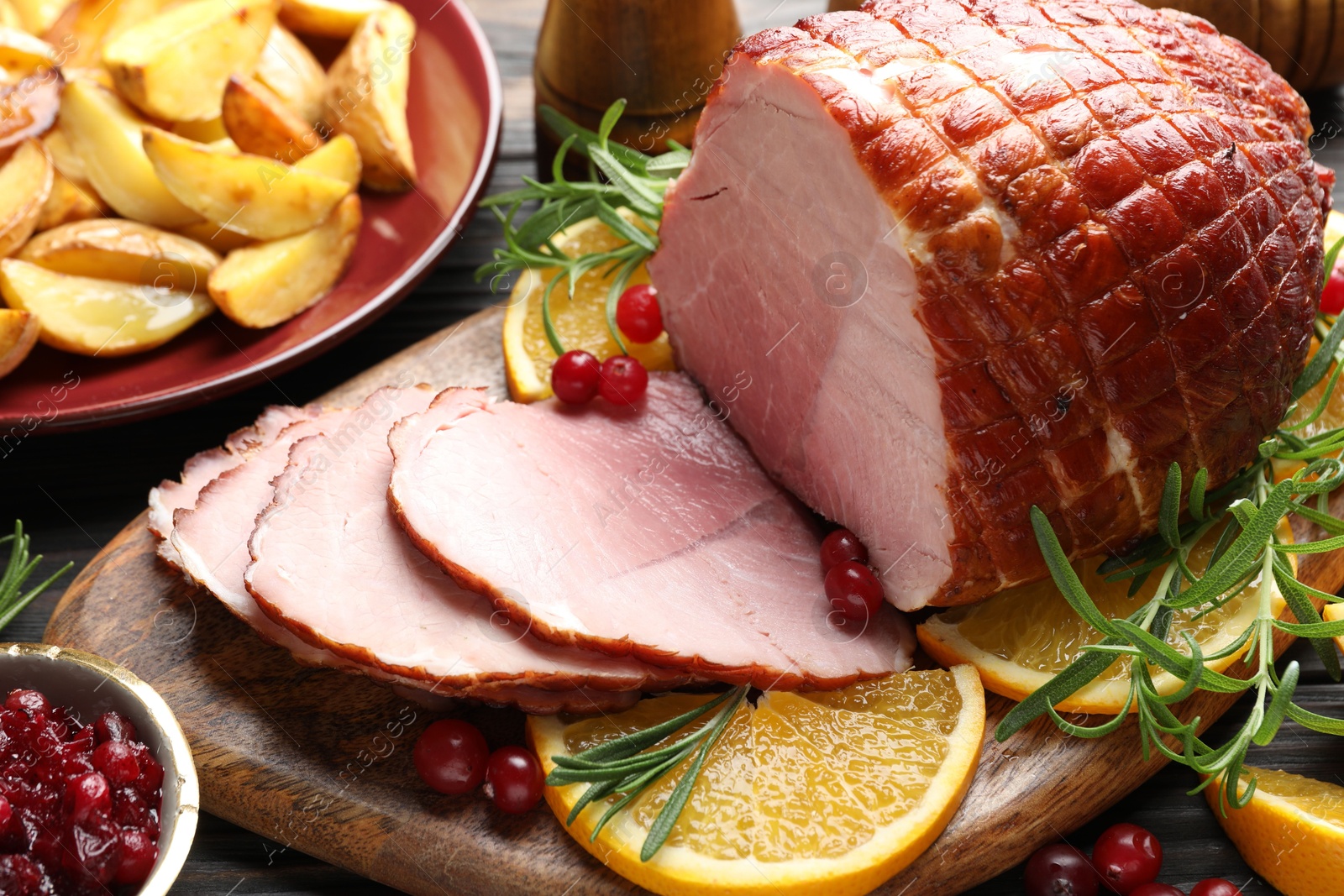 Photo of Christmas food. Tasty baked ham served on table, closeup