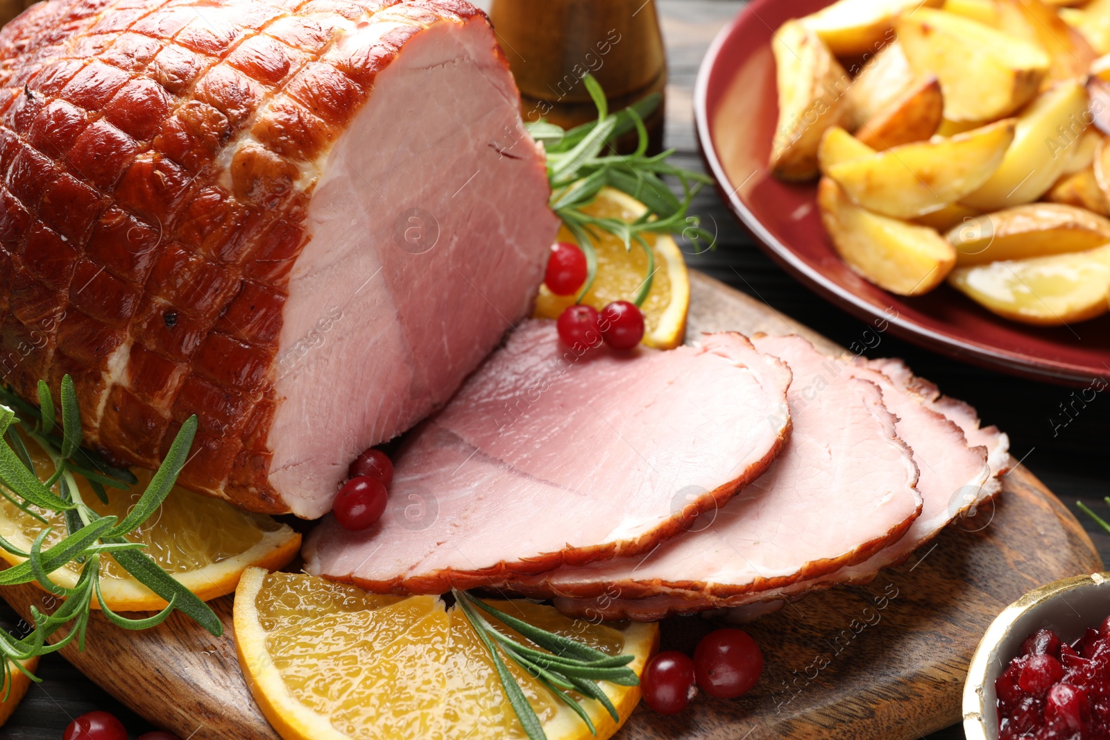 Photo of Christmas food. Tasty baked ham served on table, closeup