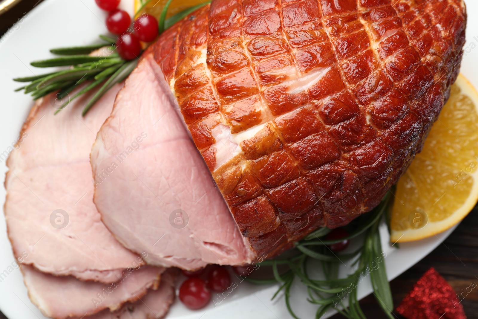 Photo of Christmas food. Tasty baked ham served on table, flat lay