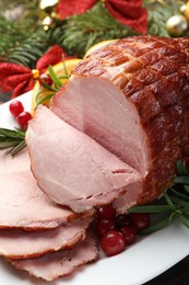 Photo of Christmas food. Tasty baked ham served on table, closeup