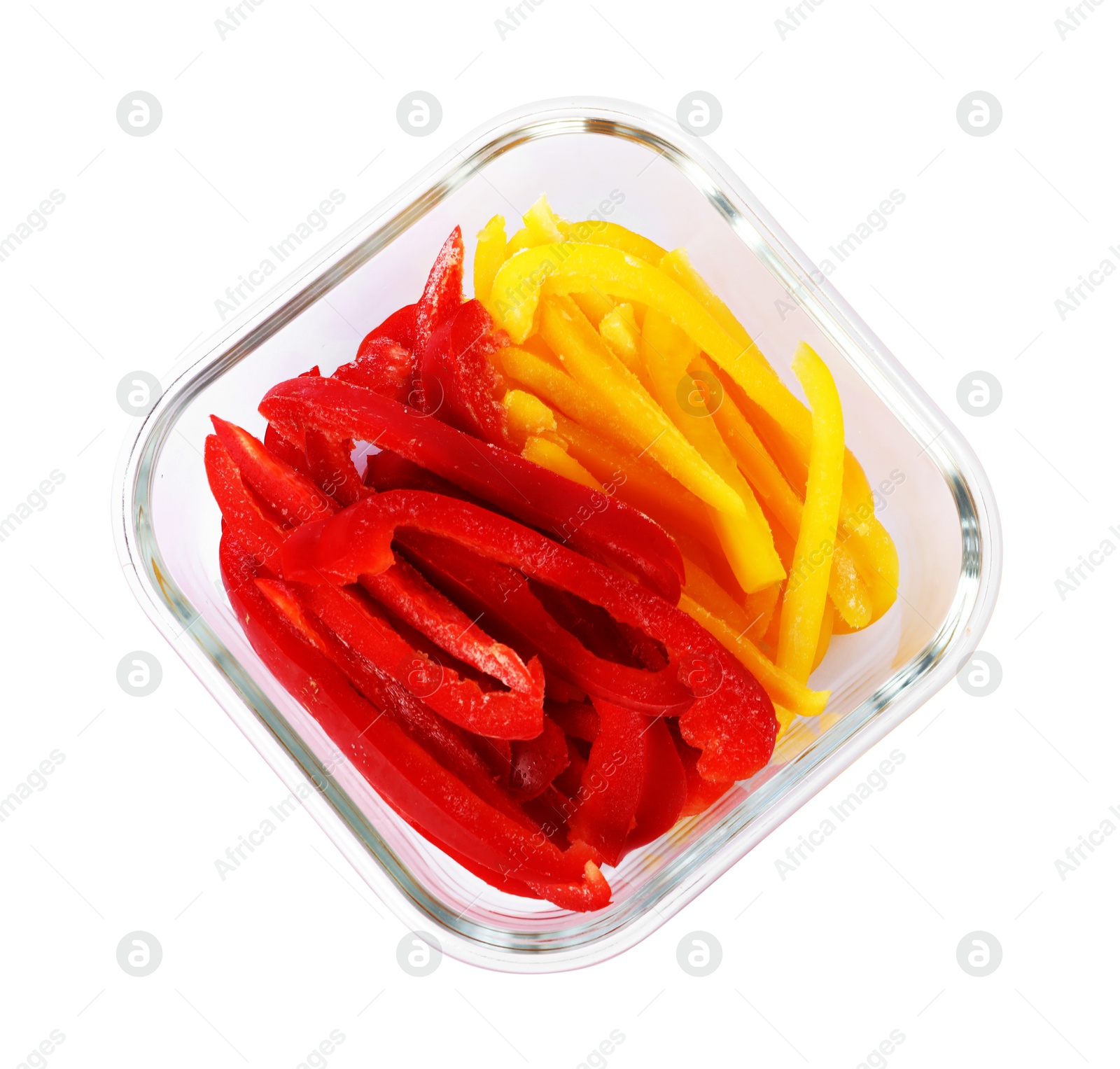 Photo of Pieces of frozen bell peppers in container isolated on white, top view